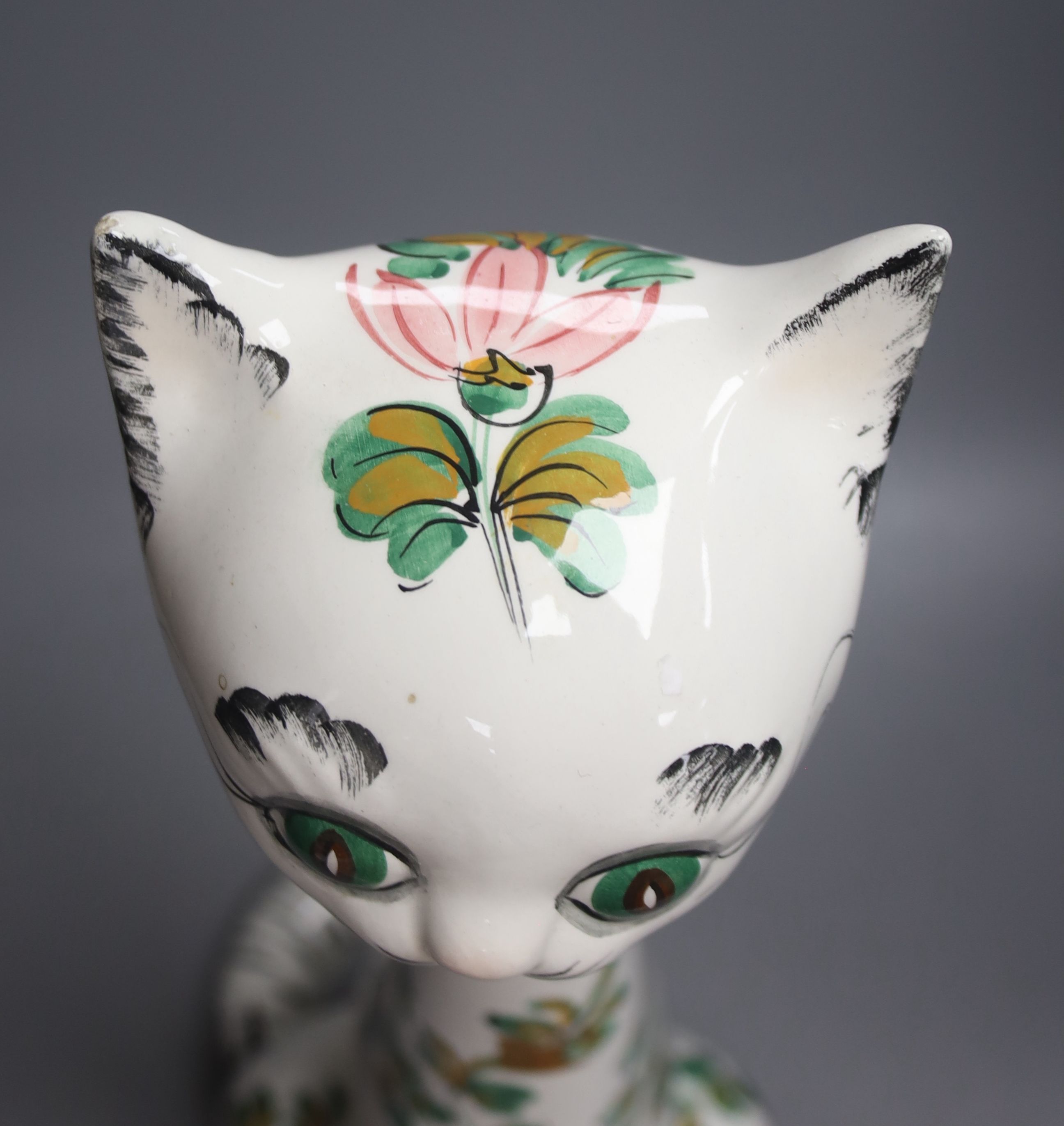 A tall Italian ceramic floral decorated cat, 57cm high